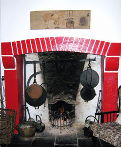 hearth with cast iron cooking utensils